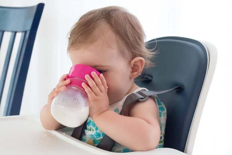 baby drinking out of a cup for baby led weaning